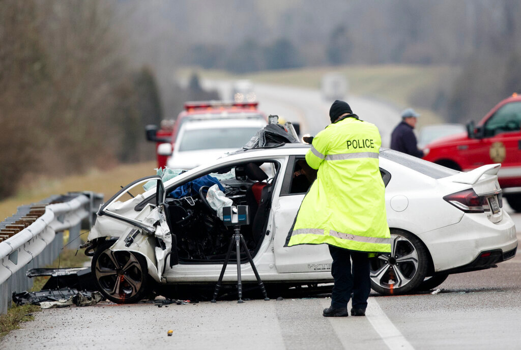 Emergency crews work the scene of a fatal crash involving a charter bus and car on the AA highway in Campbell County, Ky., Jan. 25, 2020. (Albert Cesare/The Cincinnati Enquirer via AP, File)