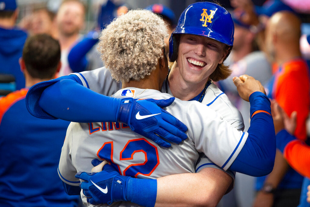 New York Mets' Francisco Lindor, back to camera, celebrates with Brett Baty, who hit a two-run home run against the Atlanta Braves during the second inning Wednesday, Aug. 17, 2022, in Atlanta. (AP Photo/Hakim Wright Sr.)