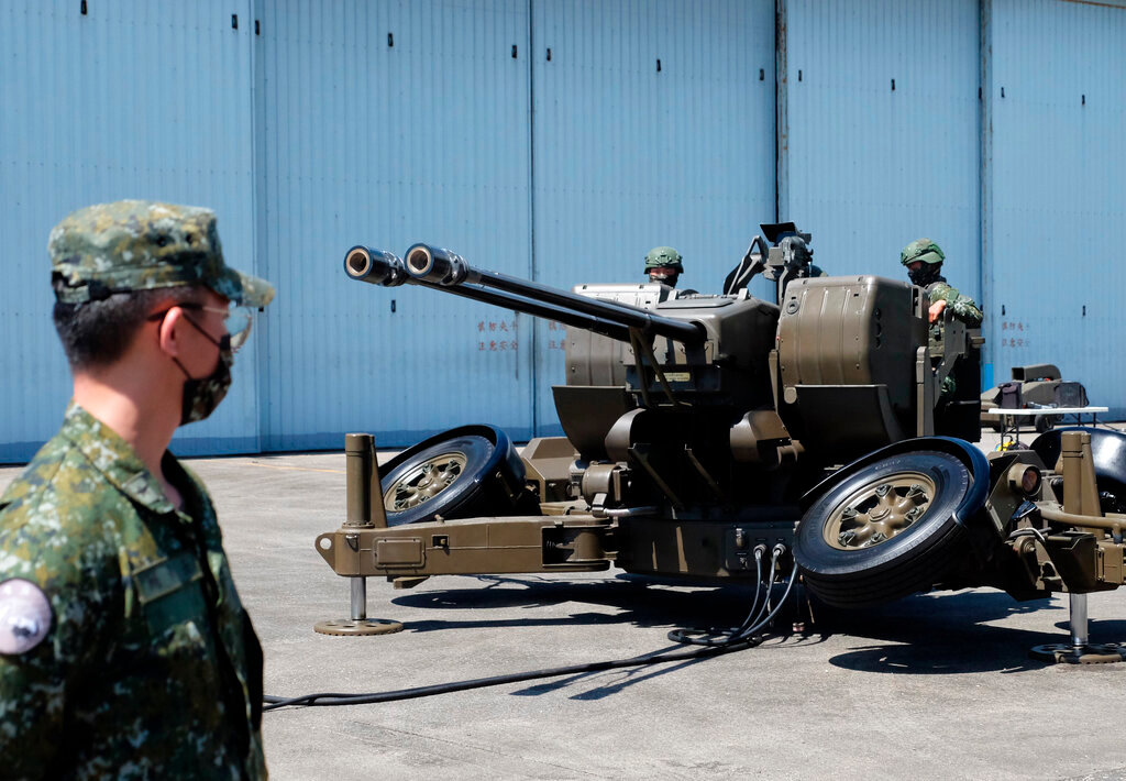 Taiwanese soldiers operate a Oerlikon 35mm twin cannon anti-aircraft gun at a base in Taiwan's southeastern Hualien county on Thursday, Aug. 18, 2022. (AP Photo/Johnson Lai)