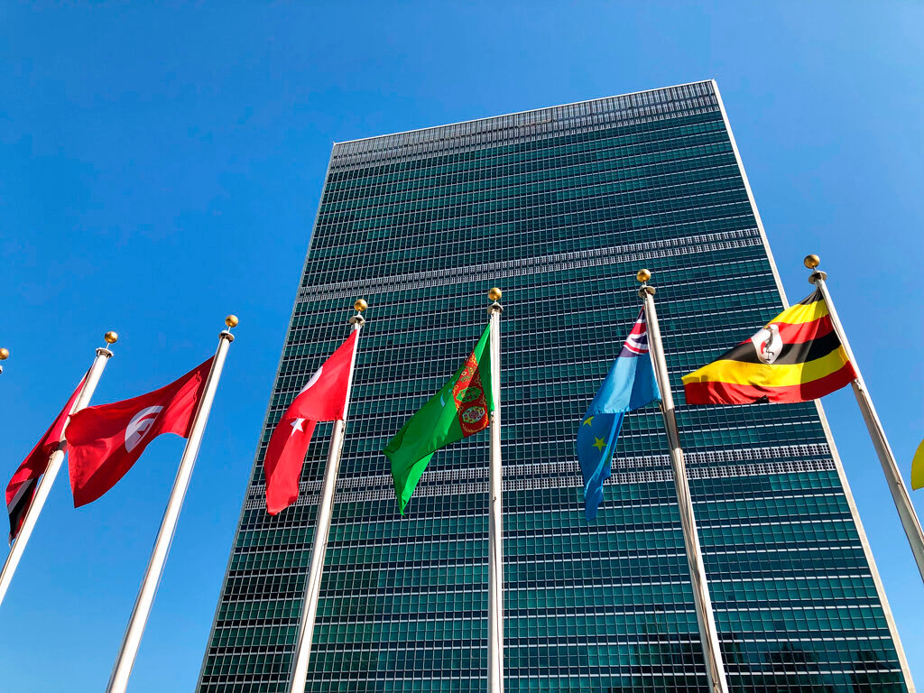 Flags fly outside United Nations headquarters in New York, Sept. 28, 2019. (AP Photo/Jennifer Peltz, File)