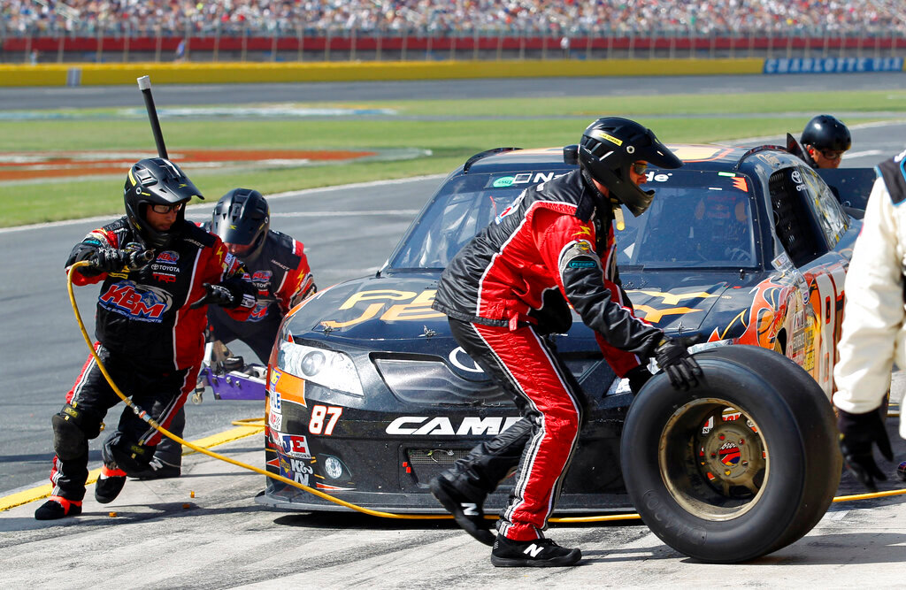 Finnish driver Kimi Raikkonen makes a pit stop during the NASCAR Nationwide Series auto race May 28, 2011, in Concord, N.C. (AP Photo/Terry Renna, File)