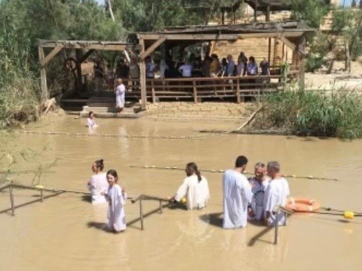 A group of Georgia Baptists gather at the Jordan River for a baptismal service. (Christian Index/Gerald Harris)