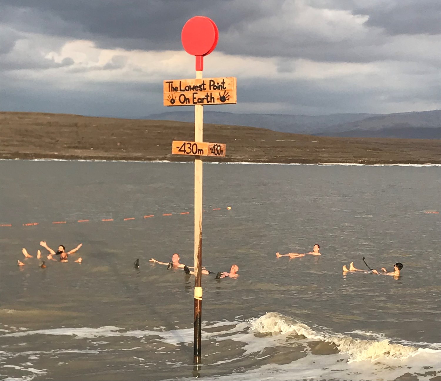 People swim in the Dead Sea, which is shrinking at a rate of some 3 feet each year. (Christian Index/Roger Alford).