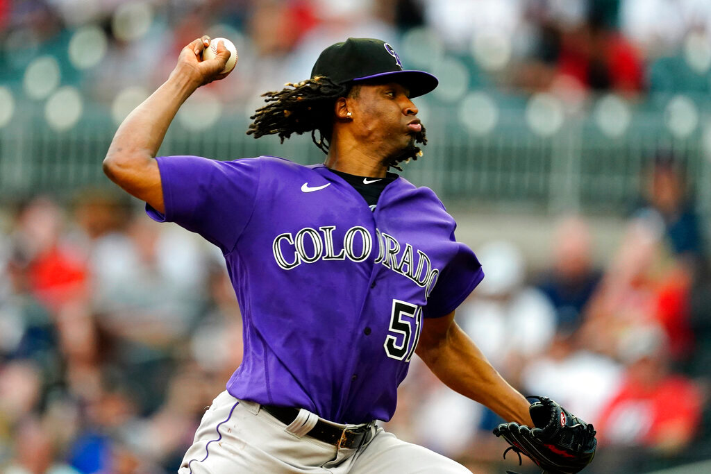 Colorado Rockies starting pitcher Jose Urena delivers to an Atlanta Braves batter during the first inning Tuesday, Aug. 30, 2022, in Atlanta. (AP Photo/John Bazemore)