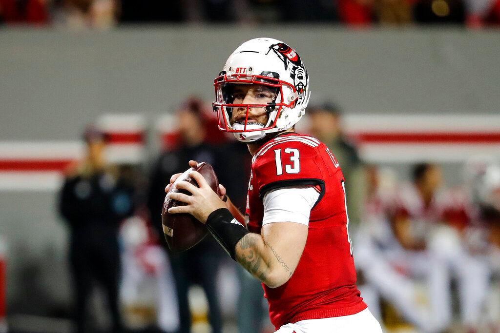 North Carolina State's Devin Leary gets ready to pass the ball against Syracuse in Raleigh, N.C., Nov. 20, 2021. (AP Photo/Karl B DeBlaker, File)
