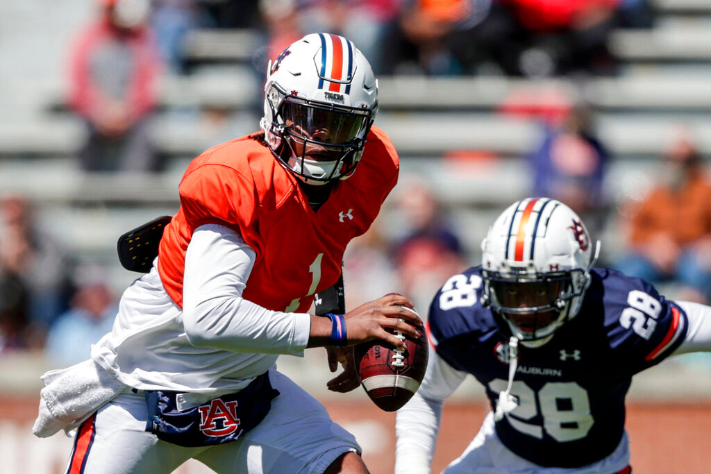 Auburn quarterback T.J. Finley scrambles for yardage during the A-Day spring football game April 9, 2022, in Auburn, Ala. (AP Photo/Butch Dill, File)