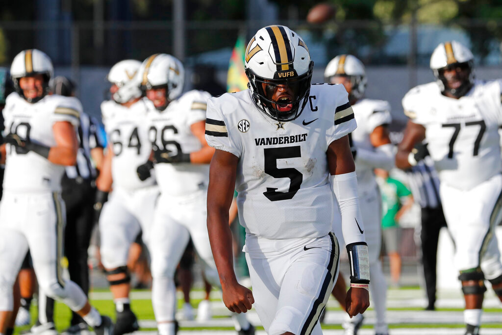 Vanderbilt quarterback Mike Wright (5) reacts after making a touchdown against Hawaii during the first half Saturday, Aug. 27, 2022, in Honolulu. (AP Photo/Marco Garcia)