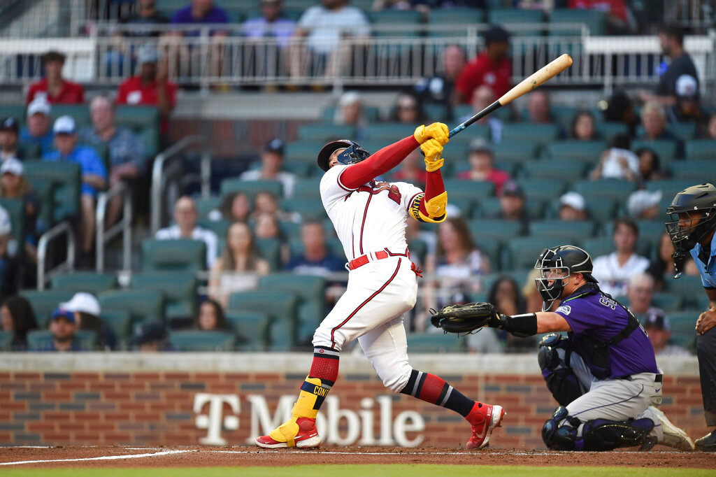 Atlanta Braves William Contreras hits a single in the first inning against the Colorado Rockies Wednesday, Aug. 31, 2022, in Atlanta. (AP Photo/Hakim Wright Sr.)