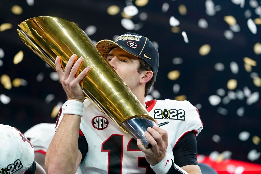 Georgia's Stetson Bennett celebrates after the College Football Playoff championship football game against Alabama, Tuesday, Jan. 11, 2022, in Indianapolis. (AP Photo/Darron Cummings, File)