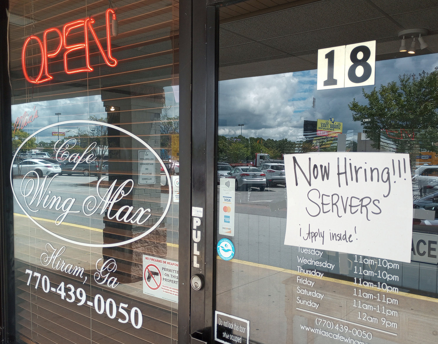 A sign on the door of a restaurant in Hiram, Ga., Aug. 25, 2022. (Christian Index/Henry Durand)