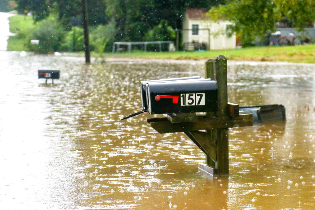 Bittings Avenue is seen partially underwater as many homes along the road were affected Sunday, Sept. 4, 2022, in Summerville, Ga. After heavy rainfall, a Flash Flood Warning was issued in Summerville Sunday. (Olivia Ross/Chattanooga Times Free Press via AP)