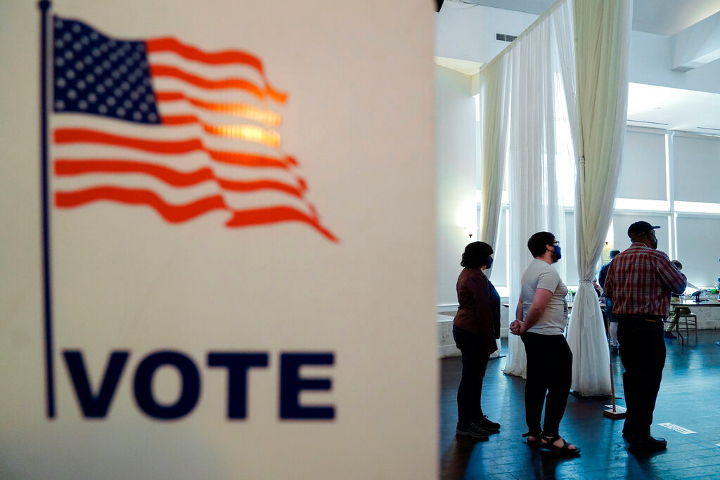 People wait in line to vote in Georgia's primary election May 24, 2022, in Atlanta. (AP Photo/Brynn Anderson, File)