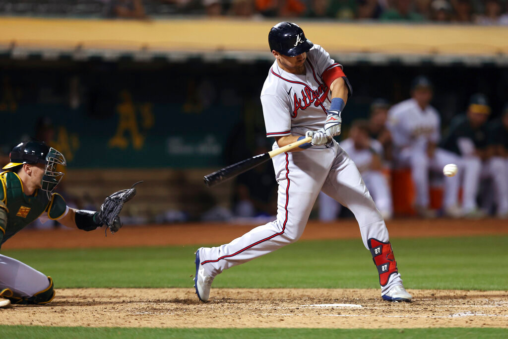 Atlanta Braves' Austin Riley hits an RBI sacrifice fly during the sixth inning against the Oakland Athletics in Oakland, Calif., Tuesday, Sept. 6, 2022. (AP Photo/Jed Jacobsohn)