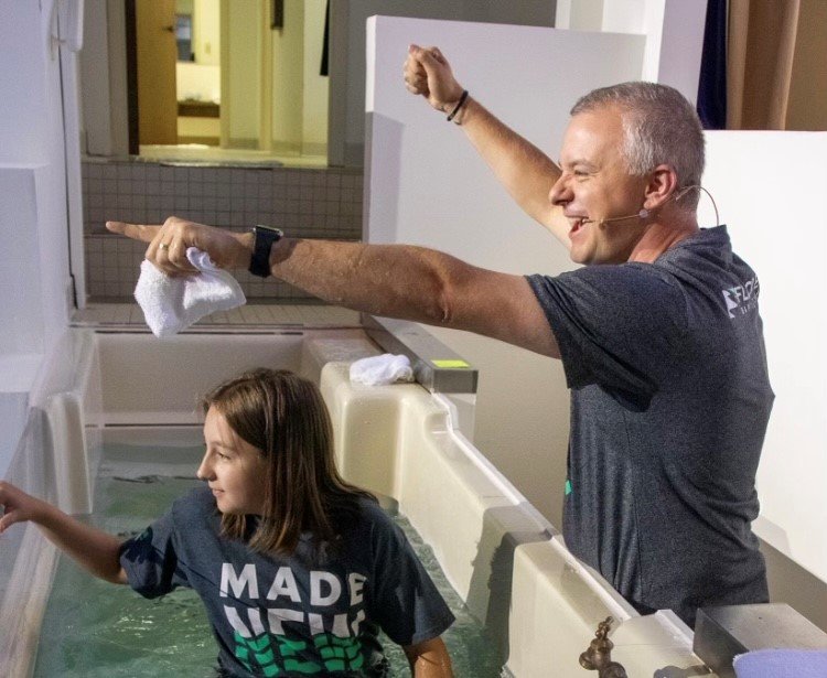Pastor Josh Saefkow baptizes Riley Wood at Fayetteville's Flat Creek Baptist Church in August. Saefkow is being nominated for president of the Georgia Baptist Convention. (Photo/Pam Hall)