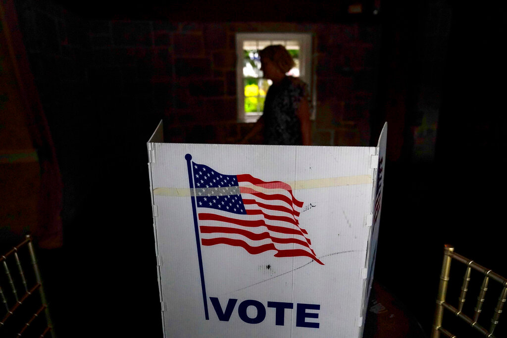 A person waits in line to vote in the Georgia's primary election on Tuesday, May 24, 2022, in Atlanta. (AP Photo/Brynn Anderson, File)