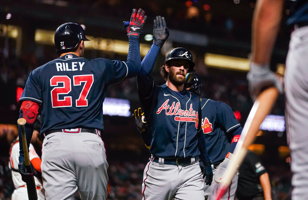 Atlanta Braves' Dansby Swanson celebrates with Austin Riley, left, after hitting a two-run home run against the San Francisco Giants during the third inning in San Francisco, Tuesday, Sept. 13, 2022. (AP Photo/Godofredo A. Vásquez)