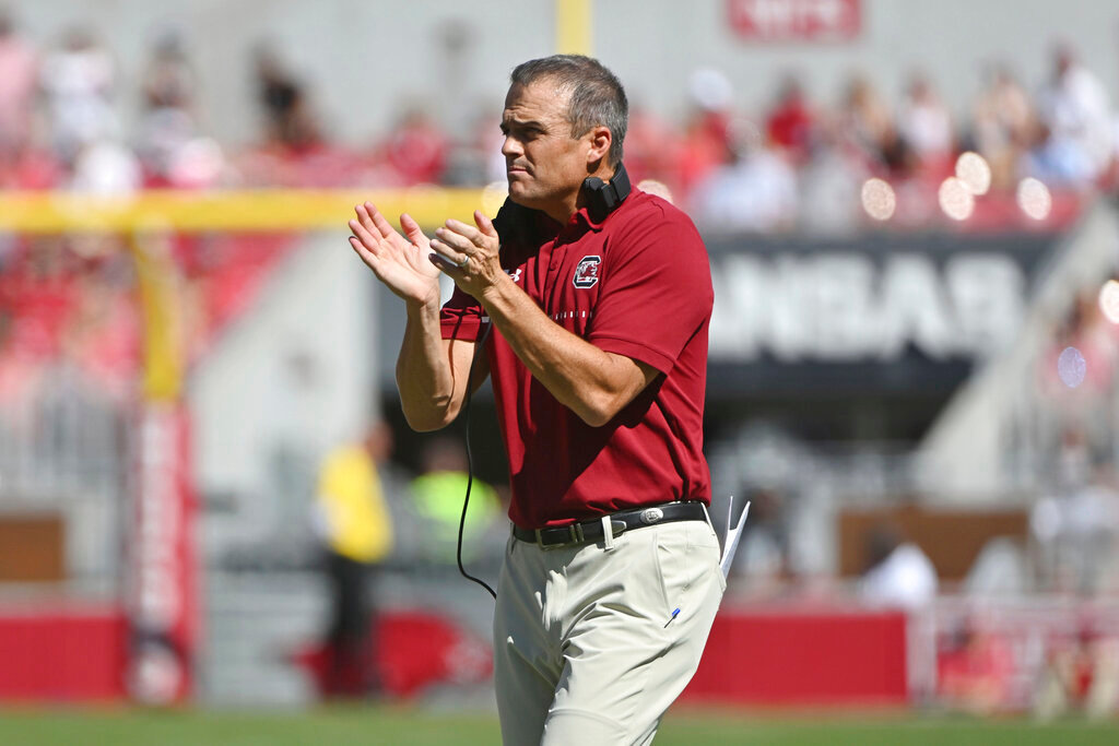 South Carolina coach Shane Beamer goes out to talk to his team during a time-out against Arkansas during the first half Saturday, Sept. 10, 2022, in Fayetteville, Ark. (AP Photo/Michael Woods)