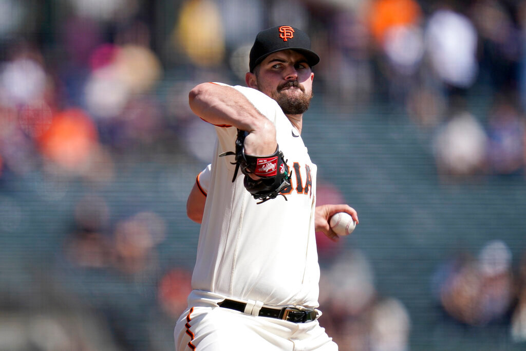 San Francisco Giants' Carlos Rodón pitches against the Atlanta Braves during the first inning in San Francisco, Wednesday, Sept. 14, 2022. (AP Photo/Godofredo A. Vásquez)