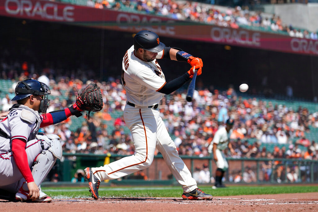San Francisco Giants' Austin Wynns hits an RBI single against the Atlanta Braves during the second inning in San Francisco, Wednesday, Sept. 14, 2022. (AP Photo/Godofredo A. Vásquez)