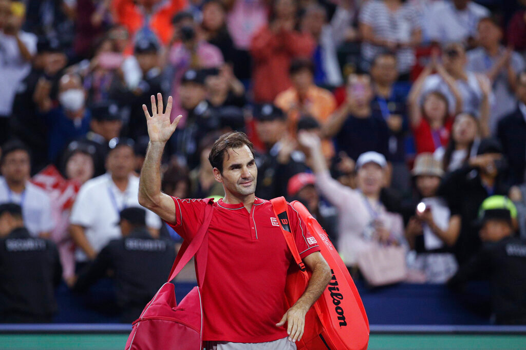 Roger Federer of Switzerland waves to spectators as he leaves the court after he lost to Alexander Zverev of Germany in their men's singles quarterfinals match at the Shanghai Masters tennis tournament at Qizhong Forest Sports City Tennis Center in Shanghai, China, Oct. 11, 2019. Federer announced Thursday, Sept. 15, 2022, he is retiring from tennis. (AP Photo/Andy Wong, File)