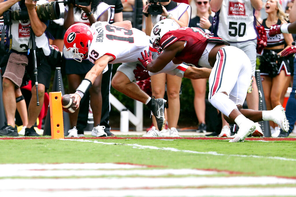 Georgia quarterback Stetson Bennett (13) is pushed out at the one-yard line by South Carolina linebacker Brad Johnson (19) during the first half Saturday, Sept. 17, 2022 in Columbia, S.C. (AP Photo/Artie Walker Jr.)
