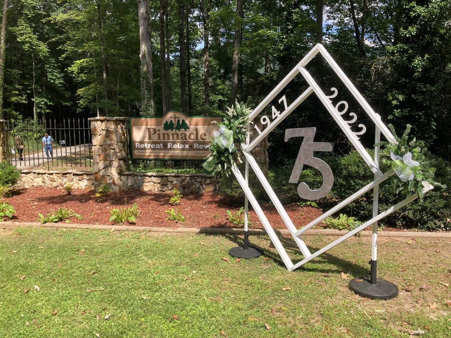 A display marks the 75th anniversary of Camp Pinnacle.