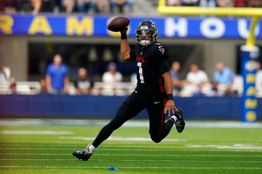 Atlanta Falcons quarterback Marcus Mariota scrambles during the first half against the Los Angeles Rams, Sunday, Sept. 18, 2022, in Inglewood, Calif. (AP Photo/Ashley Landis)