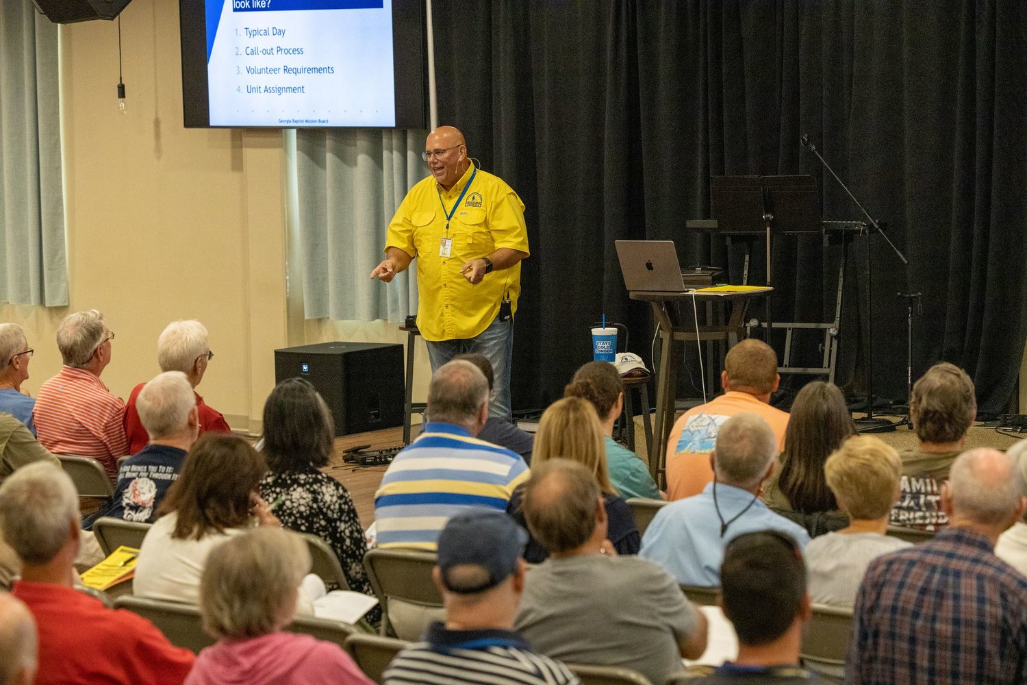 Georgia Baptist Disaster Relief Director Dwain Carter talks with volunteers during a training session on Saturday.
