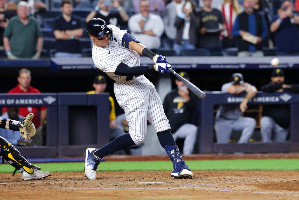 New York Yankees' Aaron Judge hits his 60th home run of the season, during the ninth inning against the Pittsburgh Pirates on Tuesday, Sept. 20, 2022, in New York. (AP Photo/Jessie Alcheh)