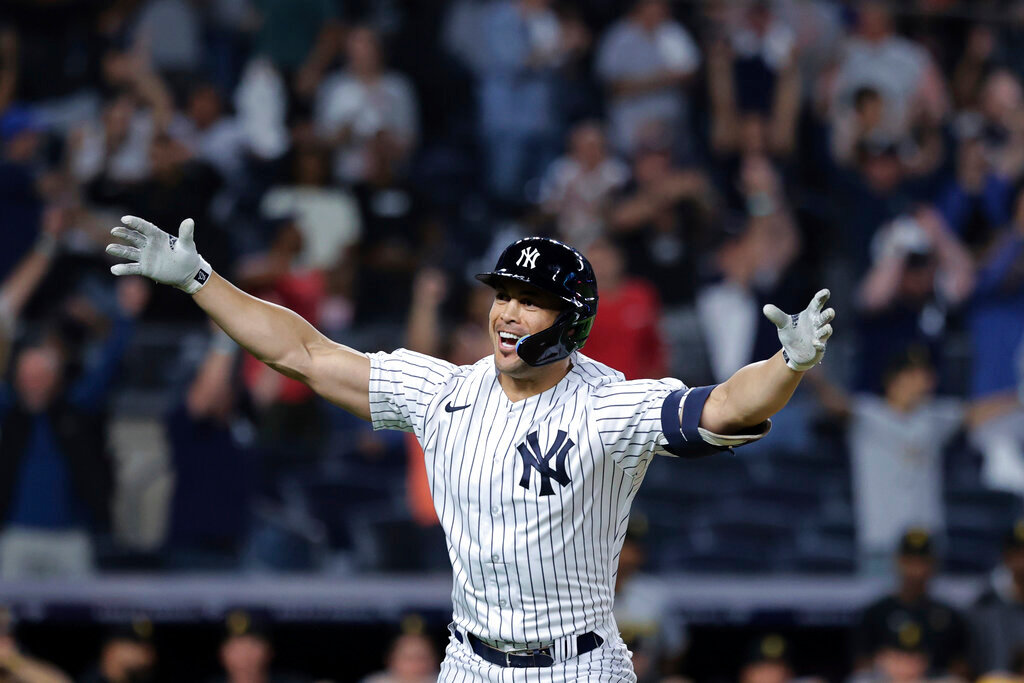 New York Yankees' Giancarlo Stanton gestures after his game-winning grand slam against the Pittsburgh Pirates, Tuesday, Sept. 20, 2022, in New York. (AP Photo/Jessie Alcheh)
