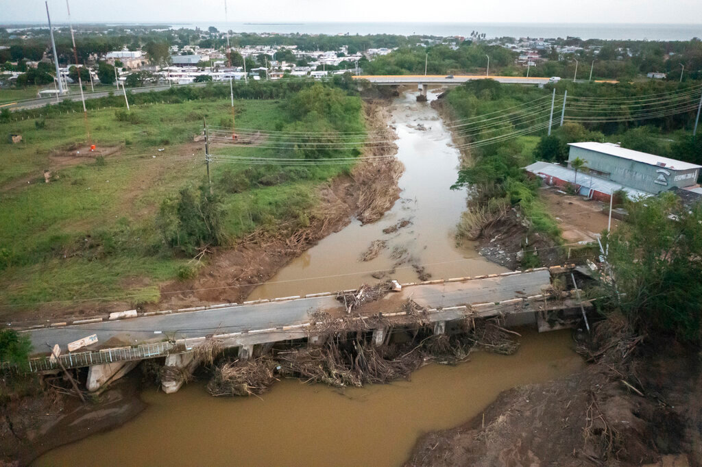 A damaged bridge in Villa Esperanza in Salinas, Puerto Rico, Wednesday, Sept. 21, 2022. (AP Photo/Alejandro Granadillo)