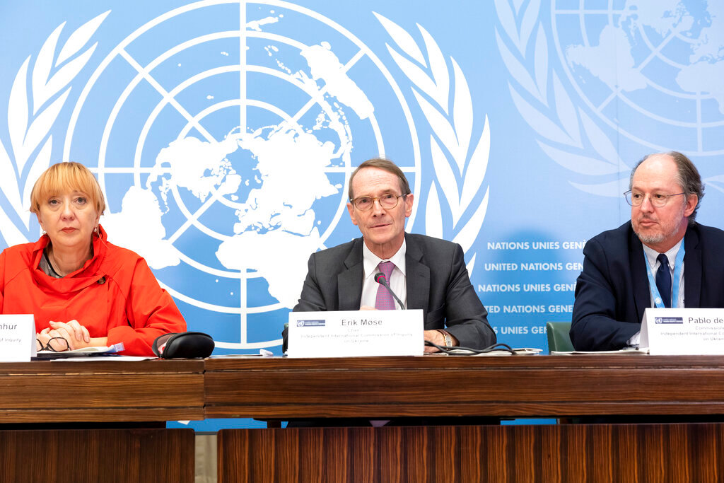 Erik Mose, center, Chair of the Commission of Inquiry on Ukraine, Jasminka Dzumhur, left, and Pablo de Greiff, right, Commissioners of Inquiry on Ukraine, talk to the media during a press conference following an update to the UN Human Rights Council, at the European headquarters of the United Nations in Geneva, Switzerland, Friday, Sept. 23, 2022. (Salvatore Di Nolfi/Keystone via AP)