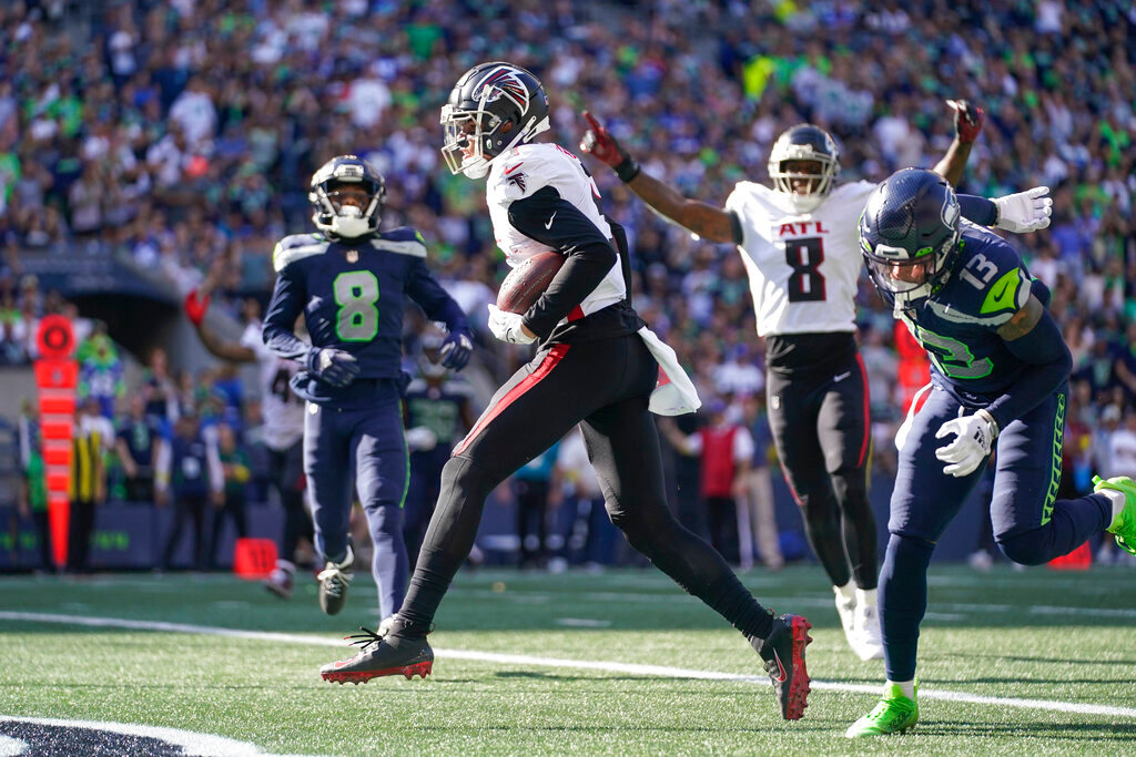 Atlanta Falcons wide receiver Drake London, center, scores a touchdown during the second half against the Atlanta Falcons, Sunday, Sept. 25, 2022, in Seattle. (AP Photo/Ashley Landis)