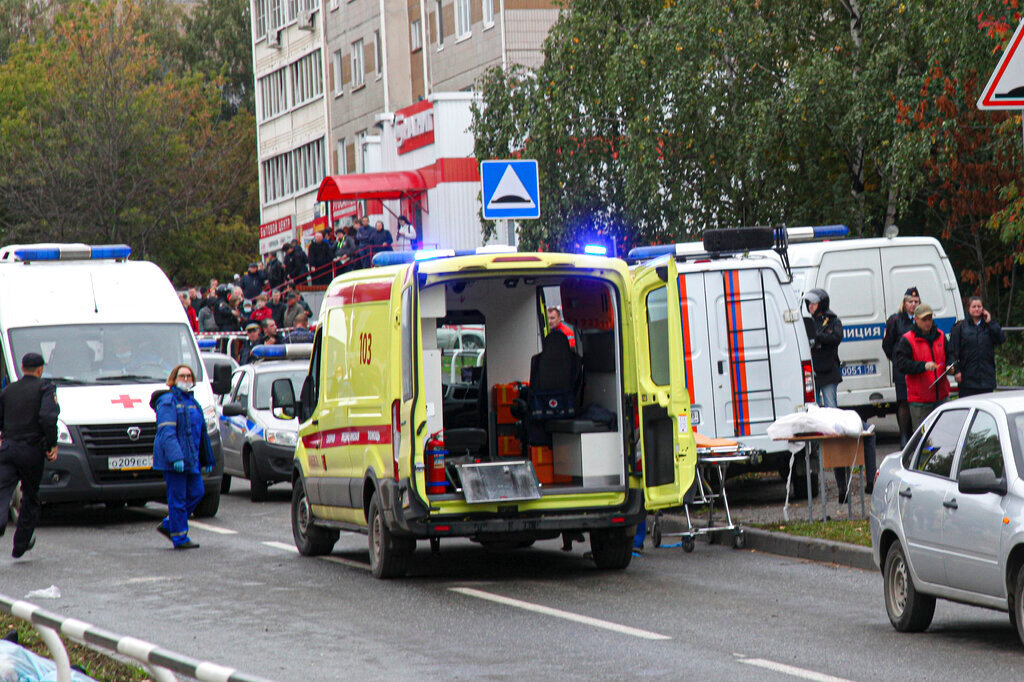 Police and paramedics work at the scene of a shooting at school No. 88 in Izhevsk, Russia, Monday, Sept. 26, 2022. (AP Photo)