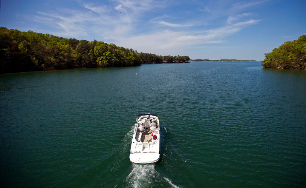 A boat passes along Lake Lanier on April 23, 2013, in Buford, Ga. (AP Photo/David Goldman, File)