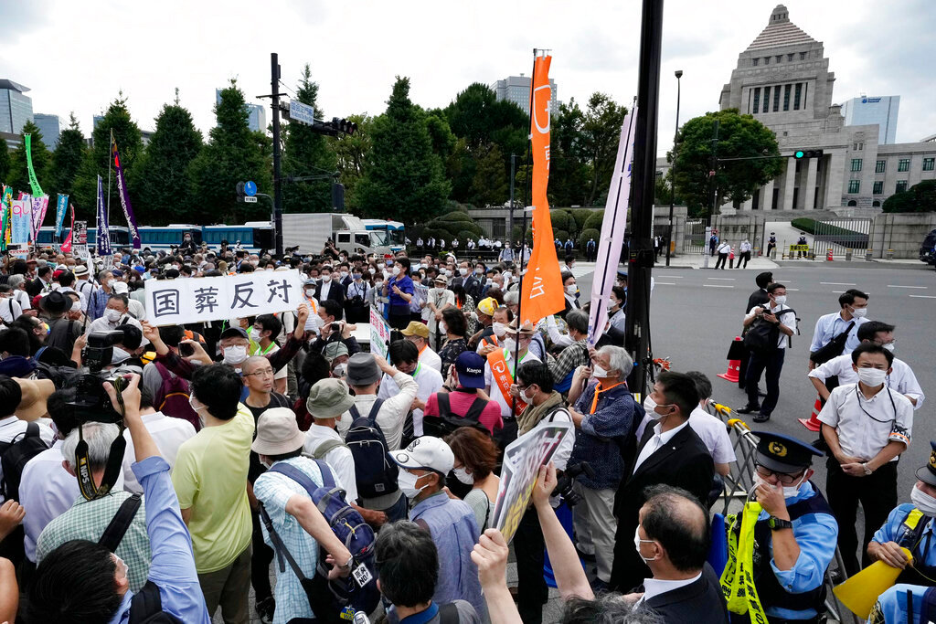 People protest against a state funeral for Japan's former Prime Minister Shinzo Abe, near the parliament in Tokyo Tuesday, Sept. 27, 2022. (Kyodo News via AP)