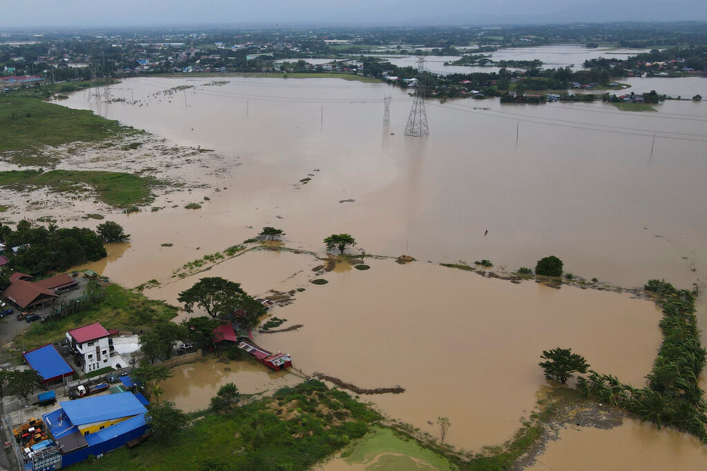 Flooding due to Typhoon Noru in San Miguel, Bulacan province, Philippines, Monday, Sept. 26, 2022. (AP Photo/Aaron Favila)