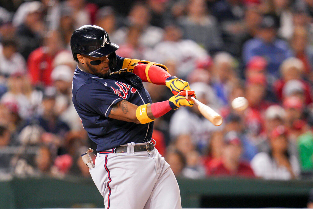 Atlanta Braves' Ronald Acuna Jr. hits a solo home run against the Washington Nationals during the fifth inning Tuesday, Sept. 27, 2022, in Washington. (AP Photo/Jess Rapfogel)