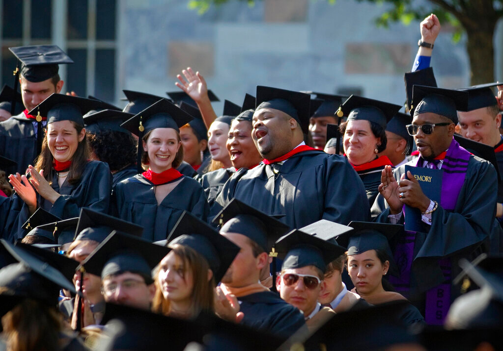Graduates of the School of Theology celebrate during Emory University's commencement ceremony May 9, 2011 in Atlanta. (AP Photo/David Goldman, File)