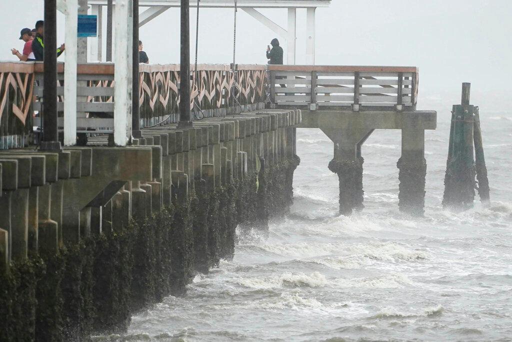 Waves crash along the Ballast Point Pier ahead of Hurricane Ian, Wednesday, Sept. 28, 2022, in Tampa, Fla. (AP Photo/Chris O'Meara)