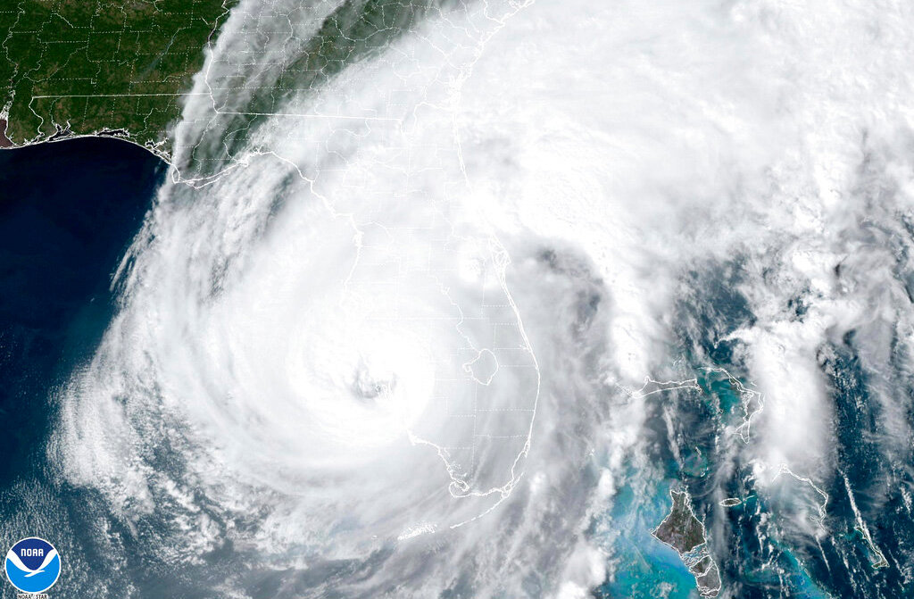 This satellite image taken at 3:06 p.m. EDT and provided by NOAA shows Hurricane Ian making landfall in southwest Florida near Cayo Costa on Wednesday, Sept. 28, 2022, as a Category 4 storm. (NOAA via AP)