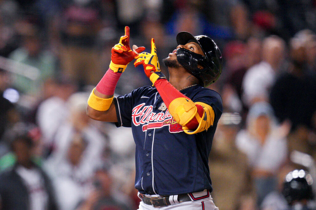 Atlanta Braves' Ronald Acuna Jr. celebrates after hitting his second solo home run against the Washington Nationals during the seventh inning of a baseball game at Nationals Park, Tuesday, Sept. 27, 2022, in Washington. The Braves won 8-2. (AP Photo/Jess Rapfogel)