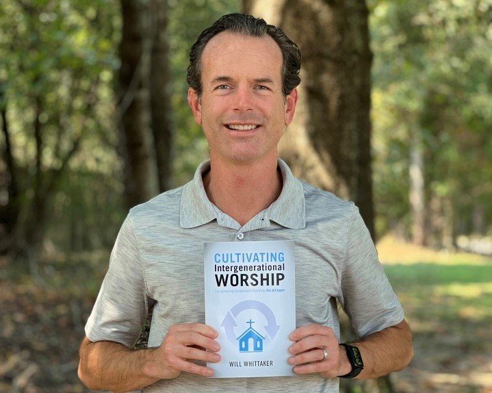 Worship pastor and author Will Whittaker poses with his book, Cultivating Intergenerational Worship, which is available from GC2 Press.