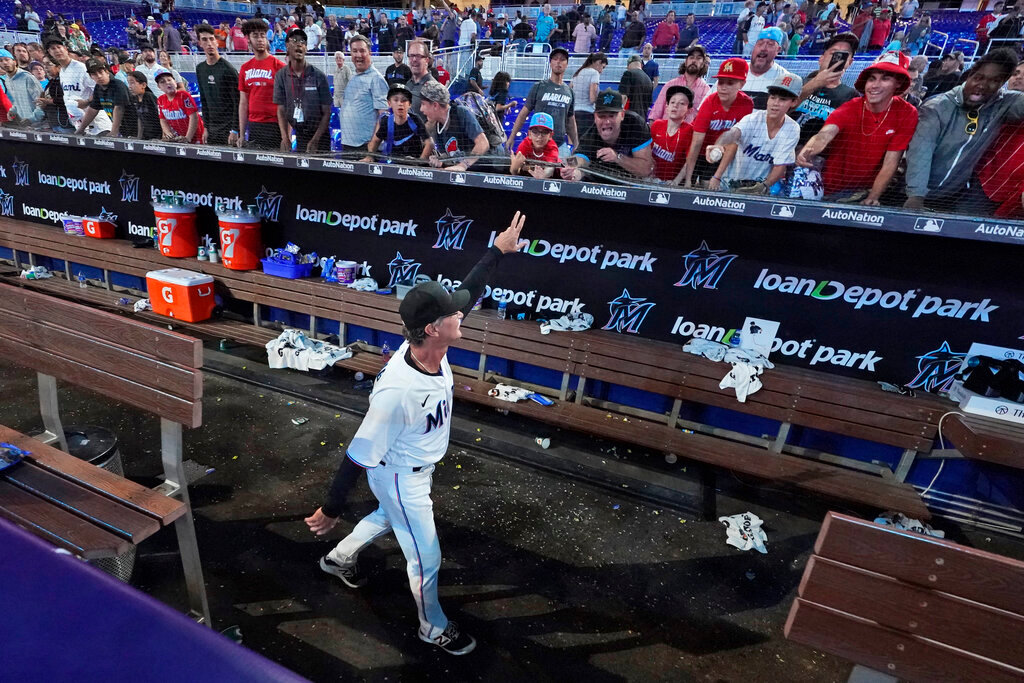 Miami Marlins manager Don Mattingly waves to the crowd after a game against the Atlanta Braves, Wednesday, Oct. 5, 2022, in Miami. (AP Photo/Wilfredo Lee)