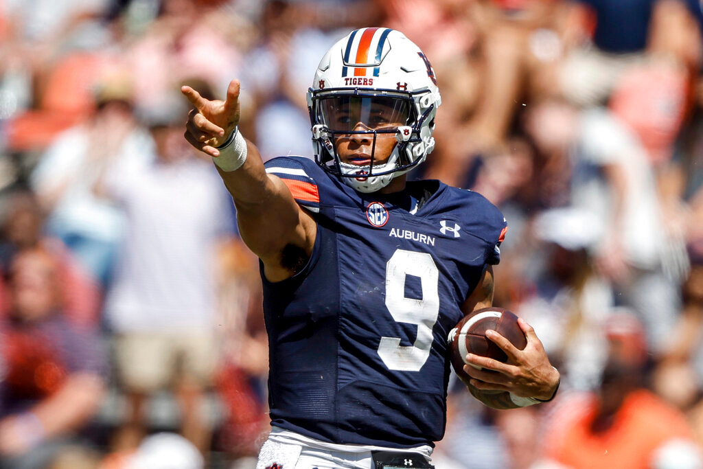 Auburn quarterback Robby Ashford reacts after making a first down during the first half against Missouri, Saturday, Sept. 24, 2022, in Auburn, Ala. (AP Photo/Butch Dill)