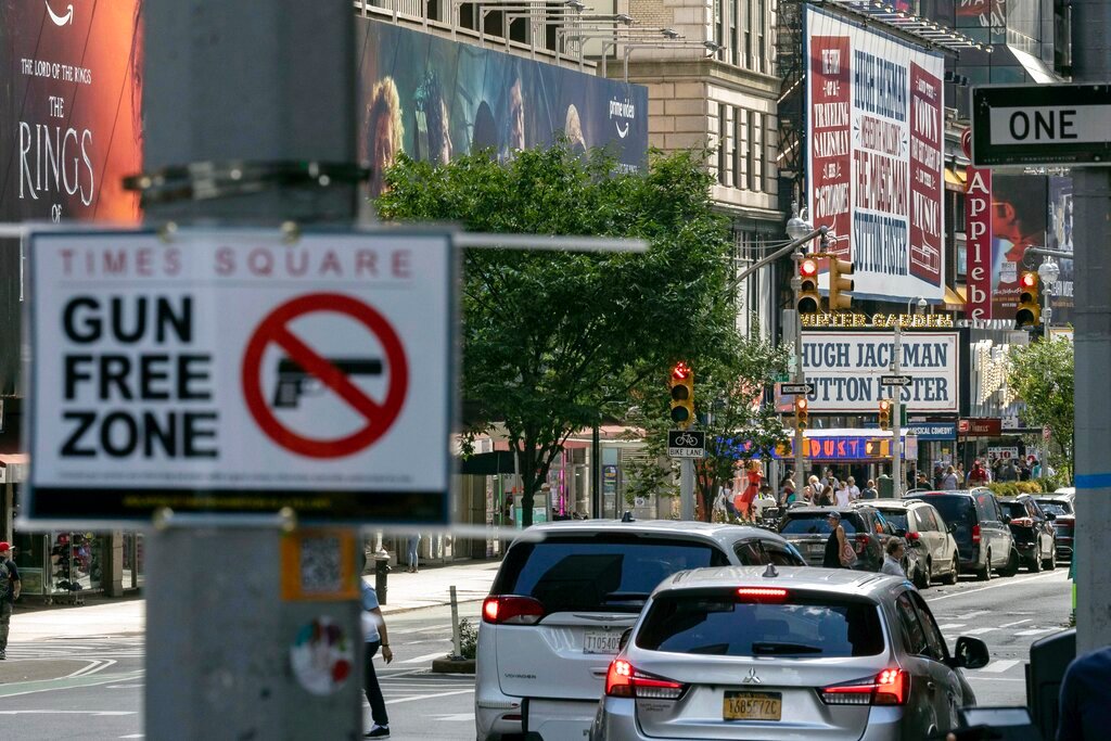 A sign reading "Gun Free Zone" is posted around Times Square, Aug. 31, 2022, in New York. (AP Photo/Yuki Iwamura, File)