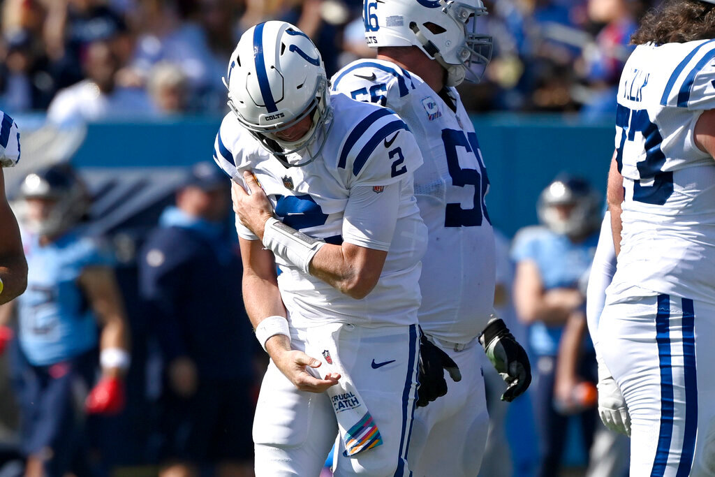 Indianapolis Colts quarterback Matt Ryan holds his shoulder after being sacked during the first half against the Tennessee Titans, Sunday, Oct. 23, 2022, in Nashville, Tenn. (AP Photo/Mark Zaleski)
