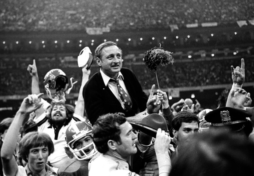 Georgia football coach Vince Dooley is carried off the field after Georgia defeated Notre Dame 17-10 in the Sugar Bowl college football game Jan. 1, 1981, in New Orleans. (AP Photo/Gene Blythe, File)