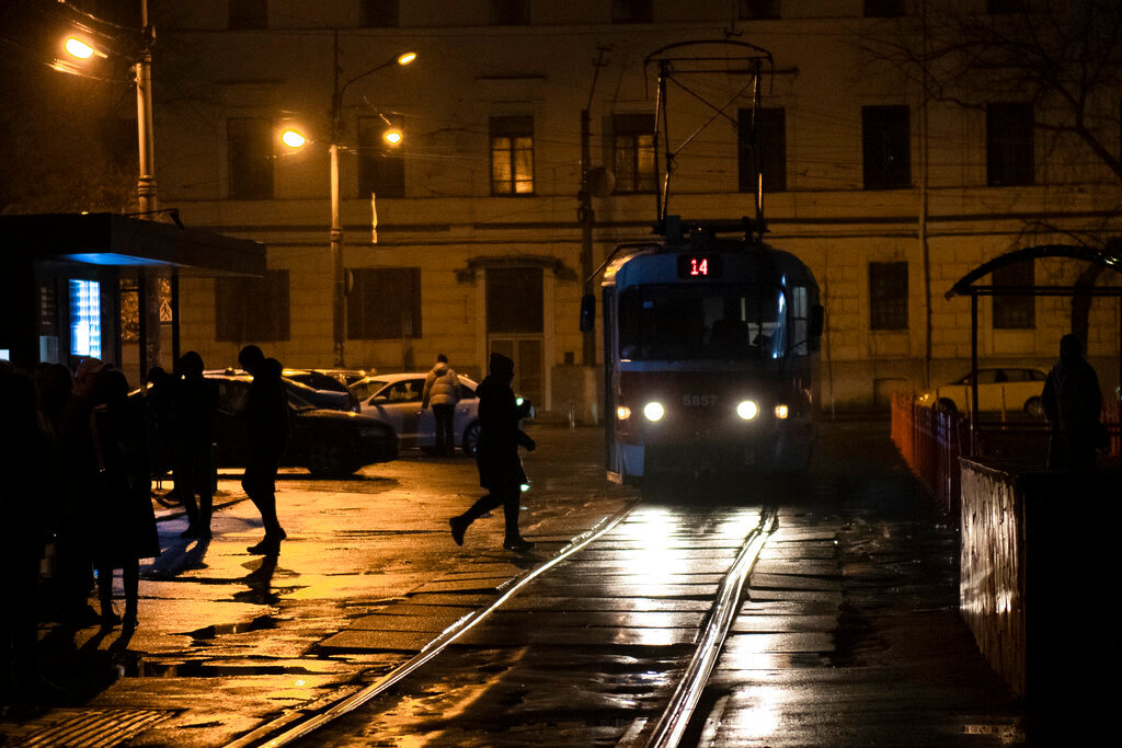 A tram arrives at a tram stop during a blackout in Kyiv, Ukraine, Sunday, Nov. 6, 2022. (AP Photo/Andrew Kravchenko)