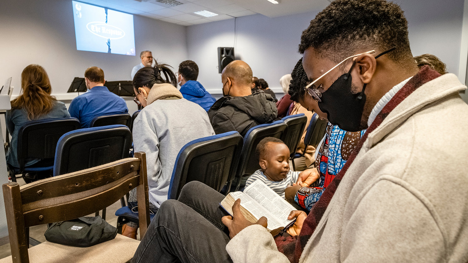 A Kenyan student reads his Bible during a worship service at the International Baptist Church in Debrecen, Hungary. (Photo/International Mission Board)